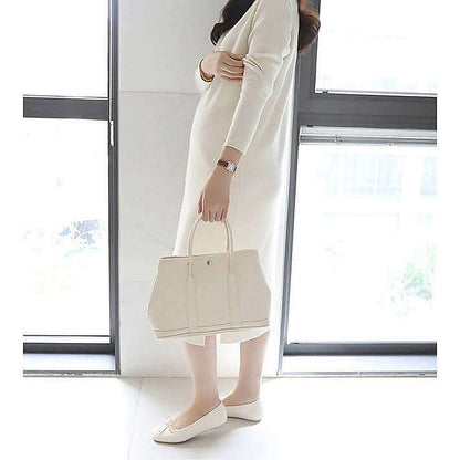 模特兒實穿米白色長裙，站於鏡前手持外套｜Stella soft v-neck knit ops（第 19 張）